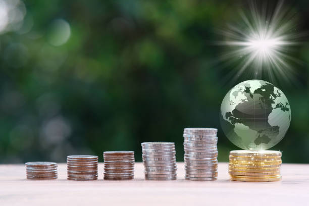 istock Stack of coin on table background and saving money concept 1321158804
