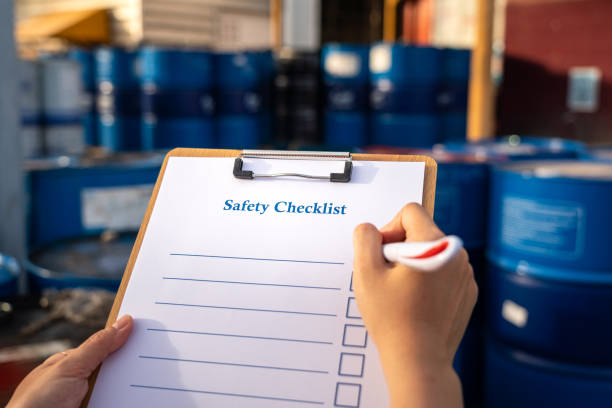 istock A safety checkilist with blurred of worker hand using pen to writing on it. 1321162057