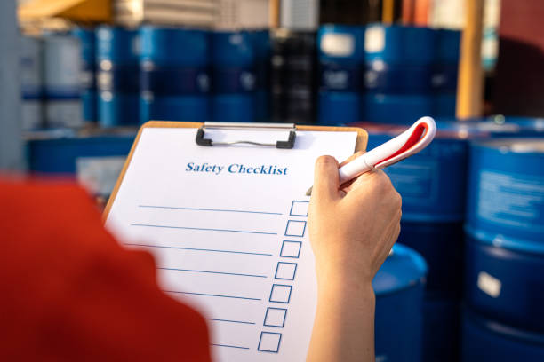 istock Writing on safety checklist document paper with blurred background of chemical storage. 1321162128