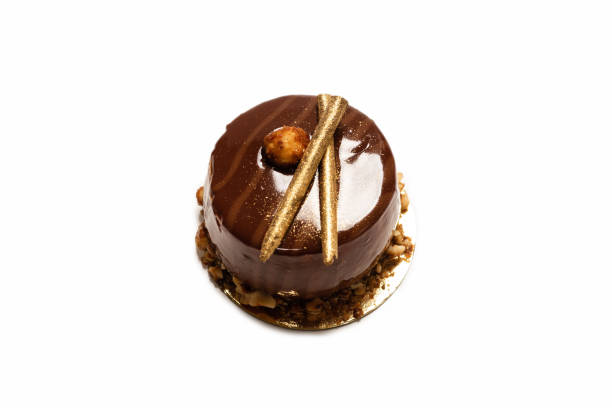 istock Chocolate and caramel cake isolated on a white background. 1321162649