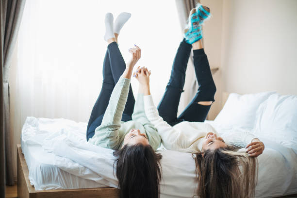 istock Two young women friends sharing happy time together 1321164933