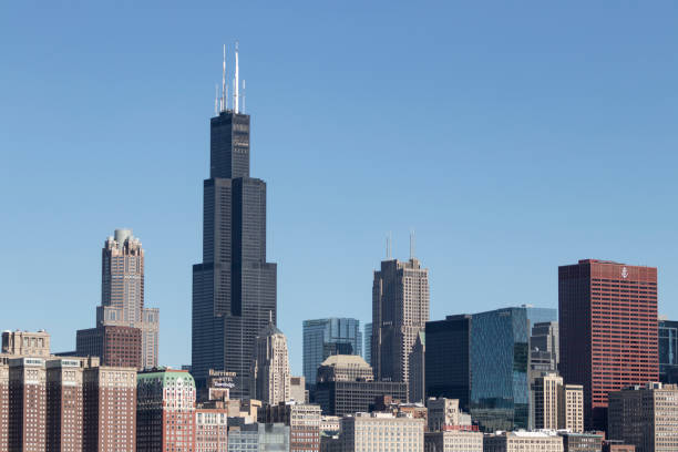 Chicago downtown skyline from Lake Michigan on a sunny day. The Windy City is home to the Cubs, Bears, Blackhawks and deep dish pizza. Chicago - Circa May 2021: Chicago downtown skyline from Lake Michigan on a sunny day. The Windy City is home to the Cubs, Bears, Blackhawks and deep dish pizza. willis tower stock pictures, royalty-free photos & images