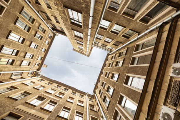 traditional court yard well in saint-petersburg, russia. walls of building and blue sky. - indoors window courtyard elegance imagens e fotografias de stock