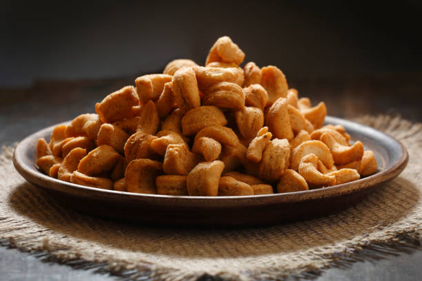 Masala kaju Namkeen Mathri / Cashew shaped namakpara - Salted Crackers is one such delightful fried Indian finger snack that is traditionally made with all white flour (maida) and lots of butter