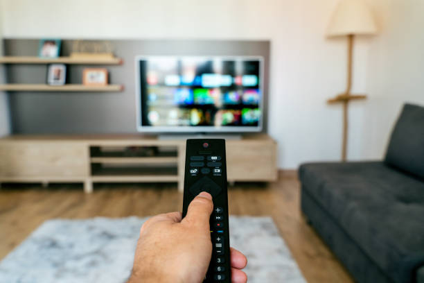 istock Looking the tv at home 1321169004