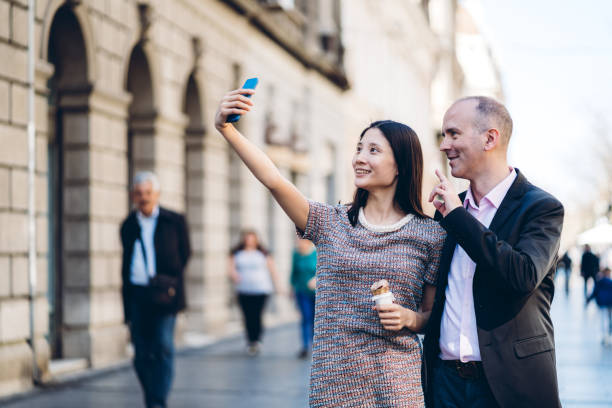 istock Multiethnic couple making selfies 1321169806
