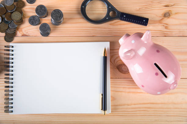 istock piggy bank, calculator and coins 1321169931