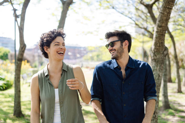 istock Smiling couple in the public park 1321170362