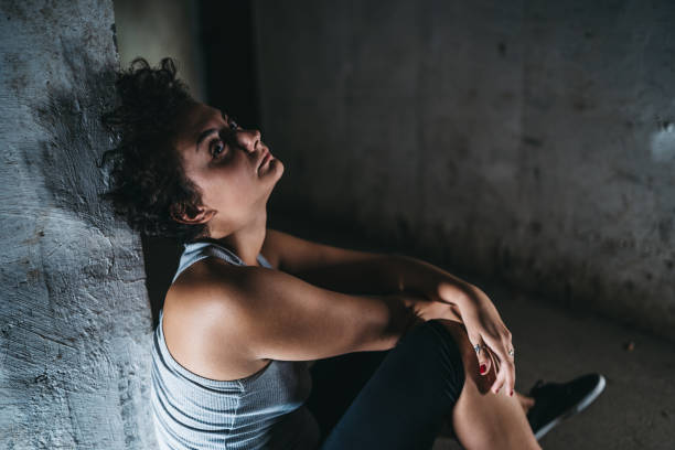 istock Depressed helpless woman sitting alone 1321171036