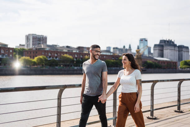 istock Couple walking in Puerto Madero 1321171076
