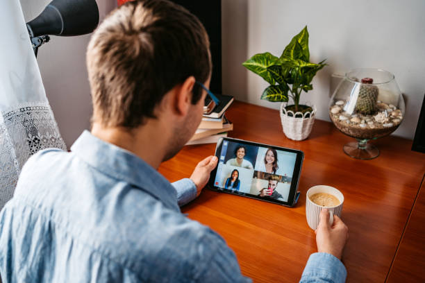 istock Man having a video call with friends 1321172843