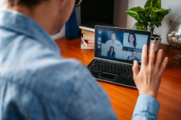 istock Man having a video call with friends 1321172877