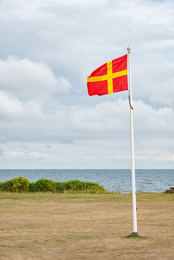 Flag of Skane in Smygehuk. Southernmost point of Sweden.