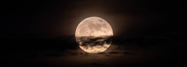 istock horizontal panoramic image of the full moon slightly obscured by clouds during the night 1321177405