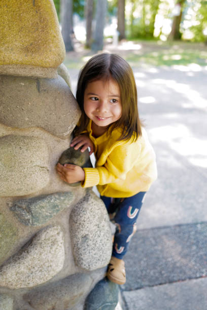 istock Young girl climbing a wall 1321178602