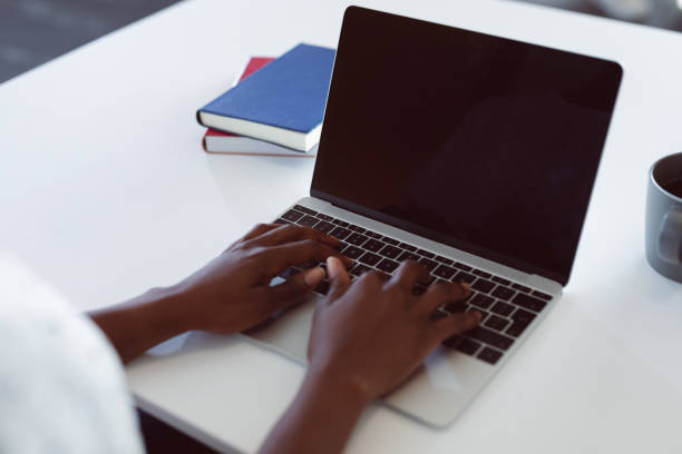 istock African american woman using laptop with copy space on screen 1321187579