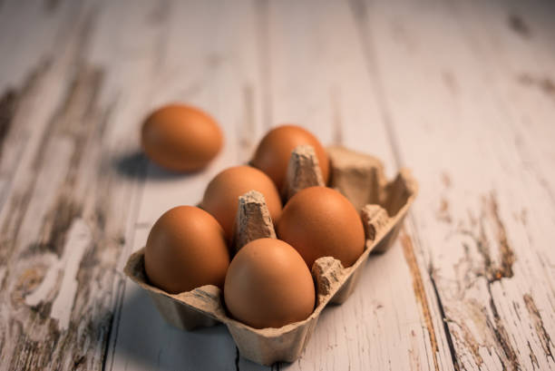 brown eggs are on white the wooden table for social media food trend food styling stock photo