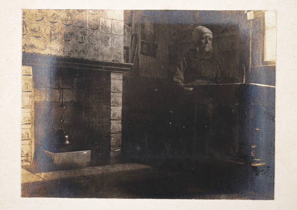 Vintage photograph of an Old Woman sat at a table, Kettle on fire, Victorian, Netherlands, Dutch, 19th Century