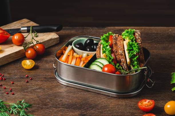 fruits, vegetables and healthy sandwich in the lunch box - chive blossom imagens e fotografias de stock