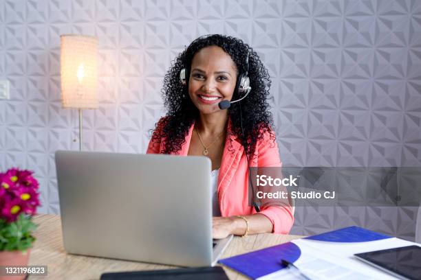 Woman Looking At Camera And Smiling While Working In Contact Center Stock Photo - Download Image Now