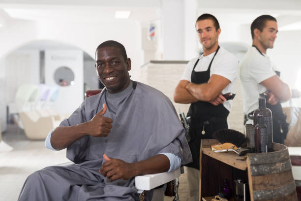 istock Delighted African male client after haircut 1321198094