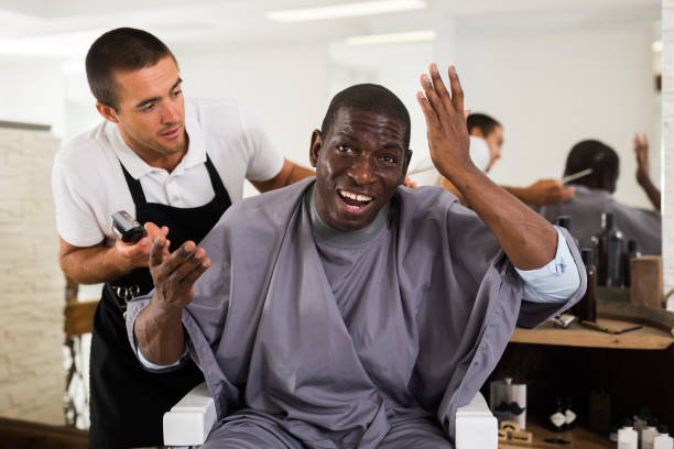 istock African man unpleasantly surprised by haircut 1321198116