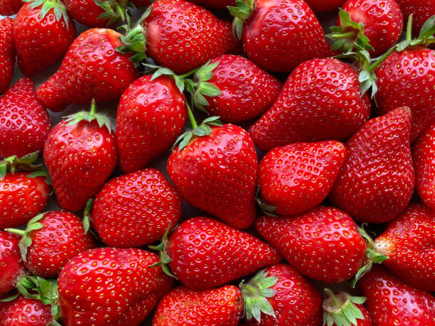 istock Flatlay from a large number of strawberries. Natural background. 1321199706