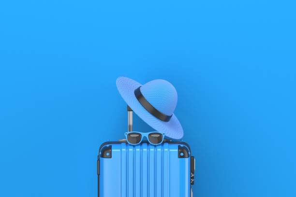 istock Blue suitcase with summer hat and sunglasses on it 3D 1321201293