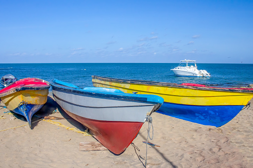 Colourful fishing boats moored on Treasure Beach, Jamaica