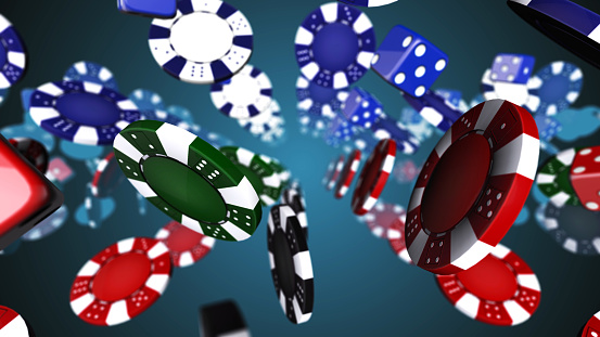 Casino chips falling on background