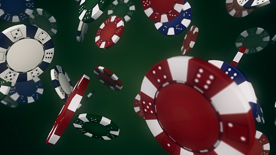 Poker chips and Euro banknotes on green background close up