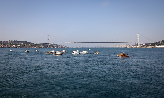 ISTANBUL, TURKEY - APRIL 29, 2021: Fisher boats in Bosphorus Strait