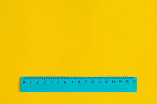 istock School pink ruler on yellow background. Top view with copy space. Flat lay. Back to school concept. 1321205051