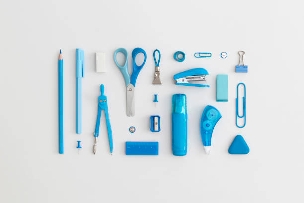 istock Blue school stationery on a grey background. Top view. Flat lay. Back to school concept. 1321205099