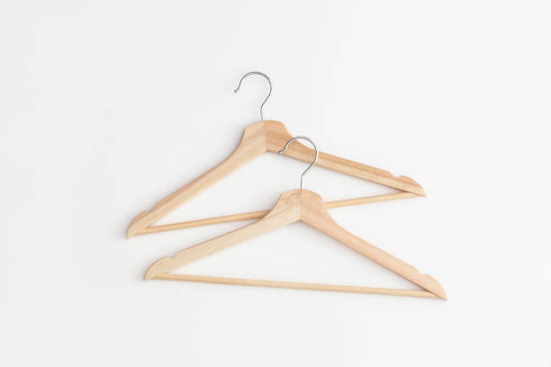 istock Wooden hangers on white background. Top view. Flat lay. 1321205177