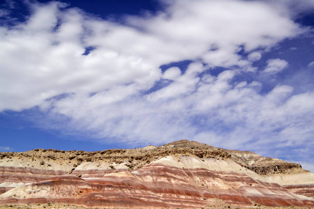 istock The Bentonite Hills and Puffy Clouds 1321205932