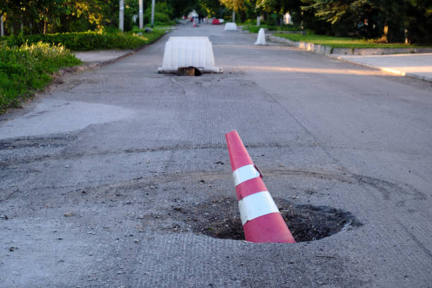 istock Road works. Warning signs. Replacement of the road surface 1321207825