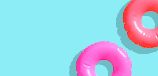 istock Inflatable swimming pool rings on blue background. 1321208840