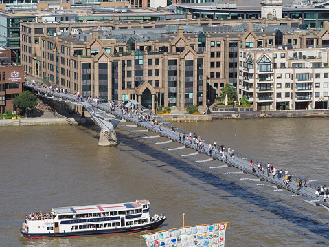 London, Uk - Circa September 2019: People crossing Millennium Bridge over River Thames linking the City of London with the South Bank between St Paul Cathedral and Tate Modern art gallery