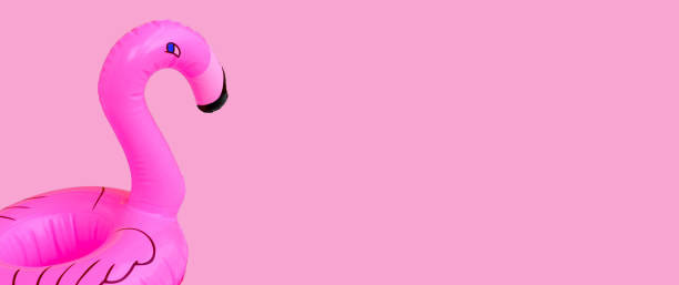 istock Flamingo inflatable swimming pool ring on pink background. 1321209690