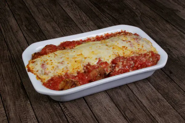 Photo of Steak Parmegiana or Parmegian Filet, made with breaded steak, tomato sauce, mozzarella cheese and Parmesan cheese.