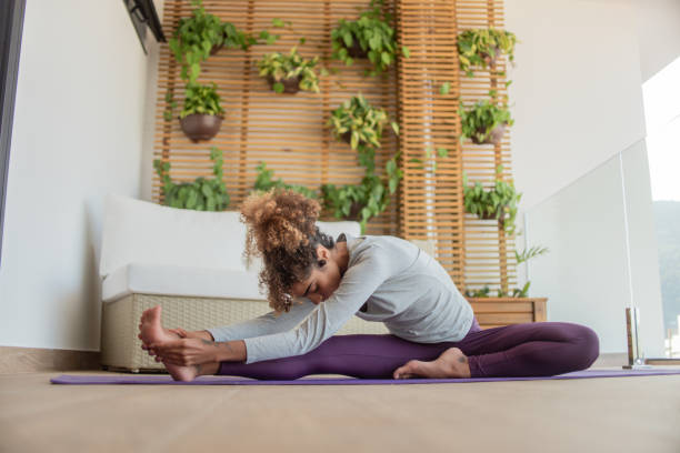 istock Young girl stretching at home. 1321211548
