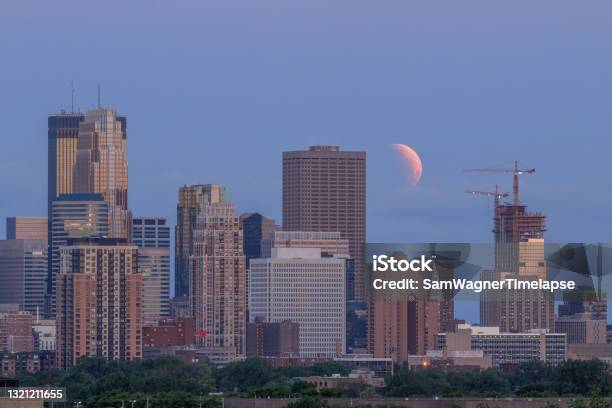 A Telephoto Shot Of A Near Total Lunar Eclipse At Moonset Over The Minneapolis Skyline Stock Photo - Download Image Now