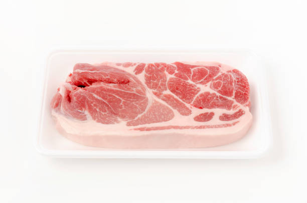 istock Raw pork meat in foam tray on white background 1321215154