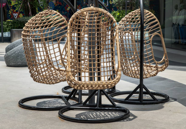 istock Relaxing three wicker rattan hanging chairs on leisure corner. 1321221445