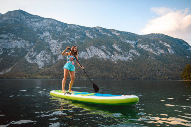 istock Mid Adult Caucasian Woman Approaching on Paddleboard 1321221687