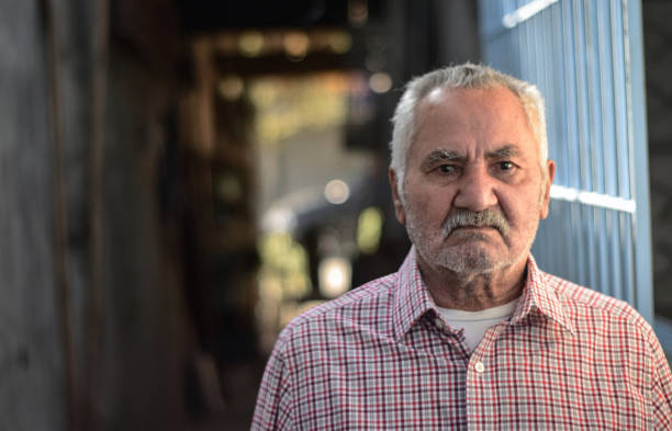 istock Old man standing in the corridor at home 1321227852