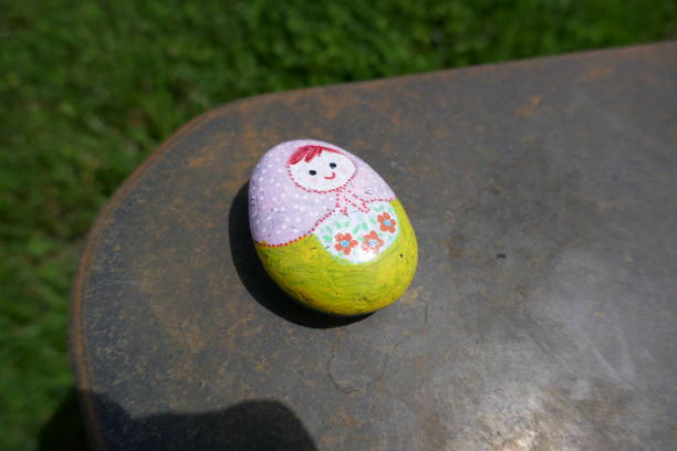 istock Kindness rock with Russian nesting doll painted on 1321228135