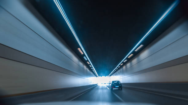 istock Motion blur of car moving inside tunnel 1321228163