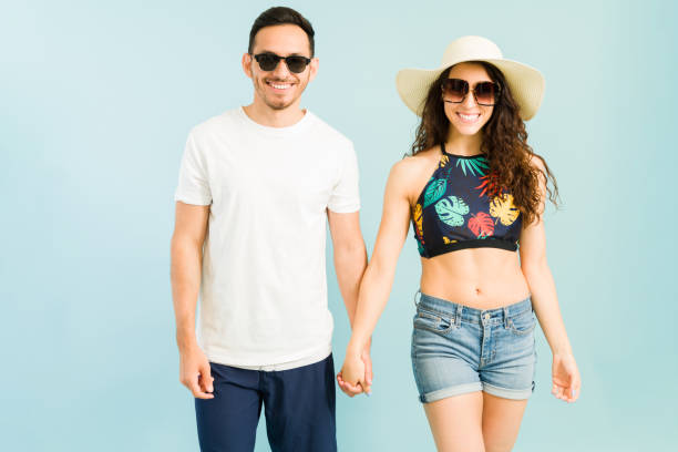 istock Couple in love smiling and going to the pool 1321229156